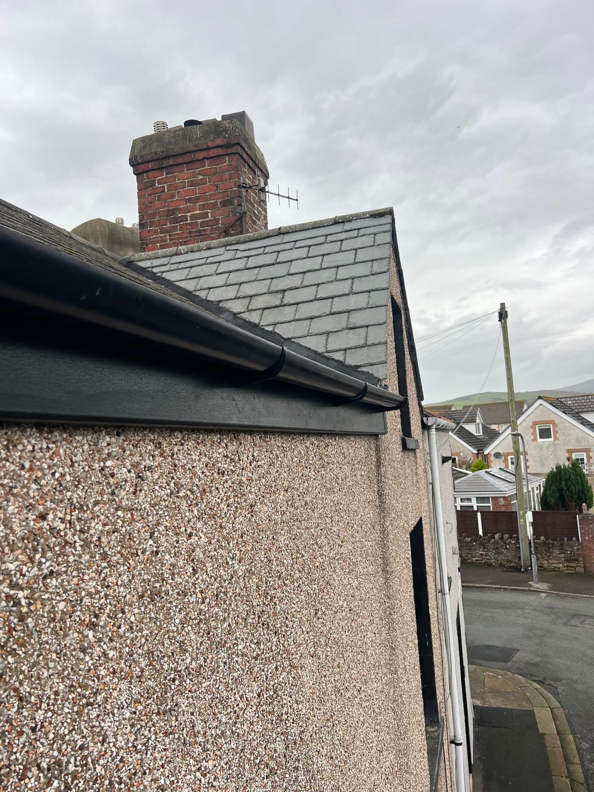 Mr Roofer UK guttering and fascia replaced in black uPVC